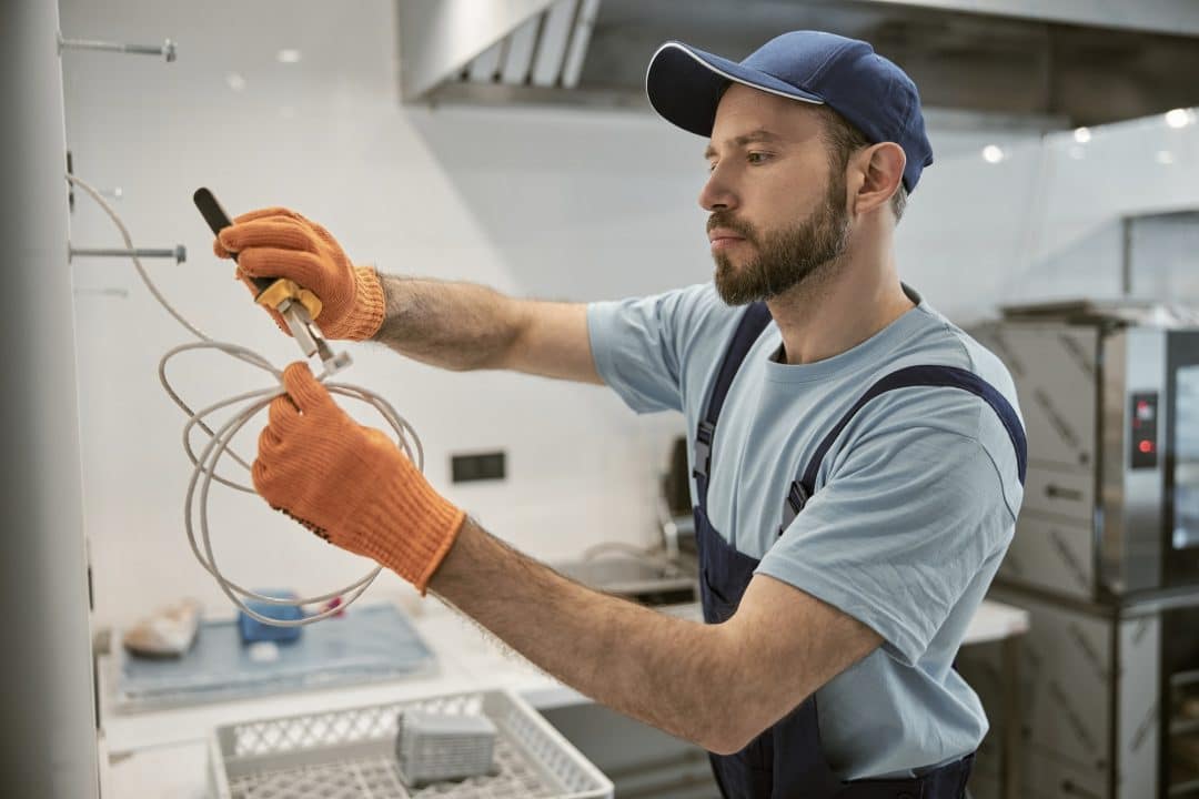 male-electrician-repairing-electric-cable-with-pliers.jpg